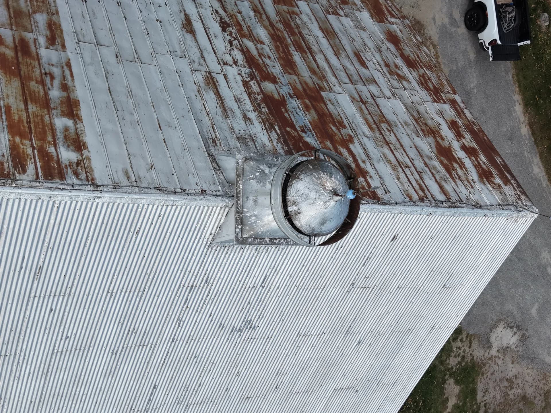 Old rusty metal roof before GraniteShield standing seam replacement Maine