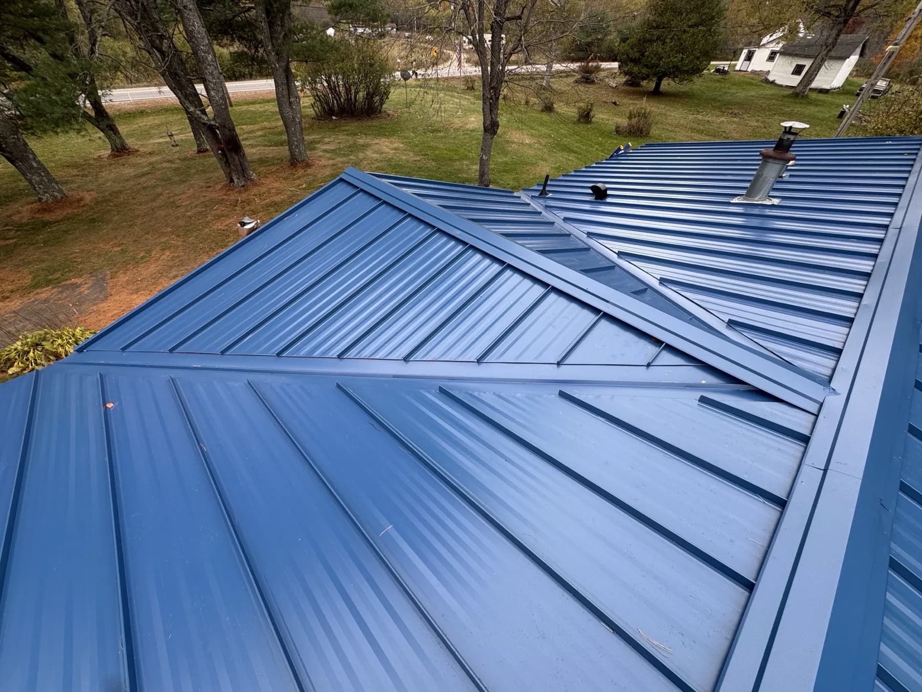 Precision standing seam metal valley and trim detail from a completed Southern Maine GraniteShield roofing project