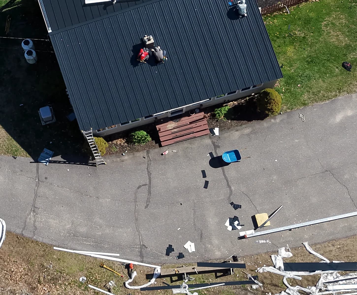 Finished standing seam roof plane on a home in Gorham, Maine by GraniteShield Roofing & Exteriors